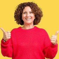 woman in red shirt giving thumbs up 